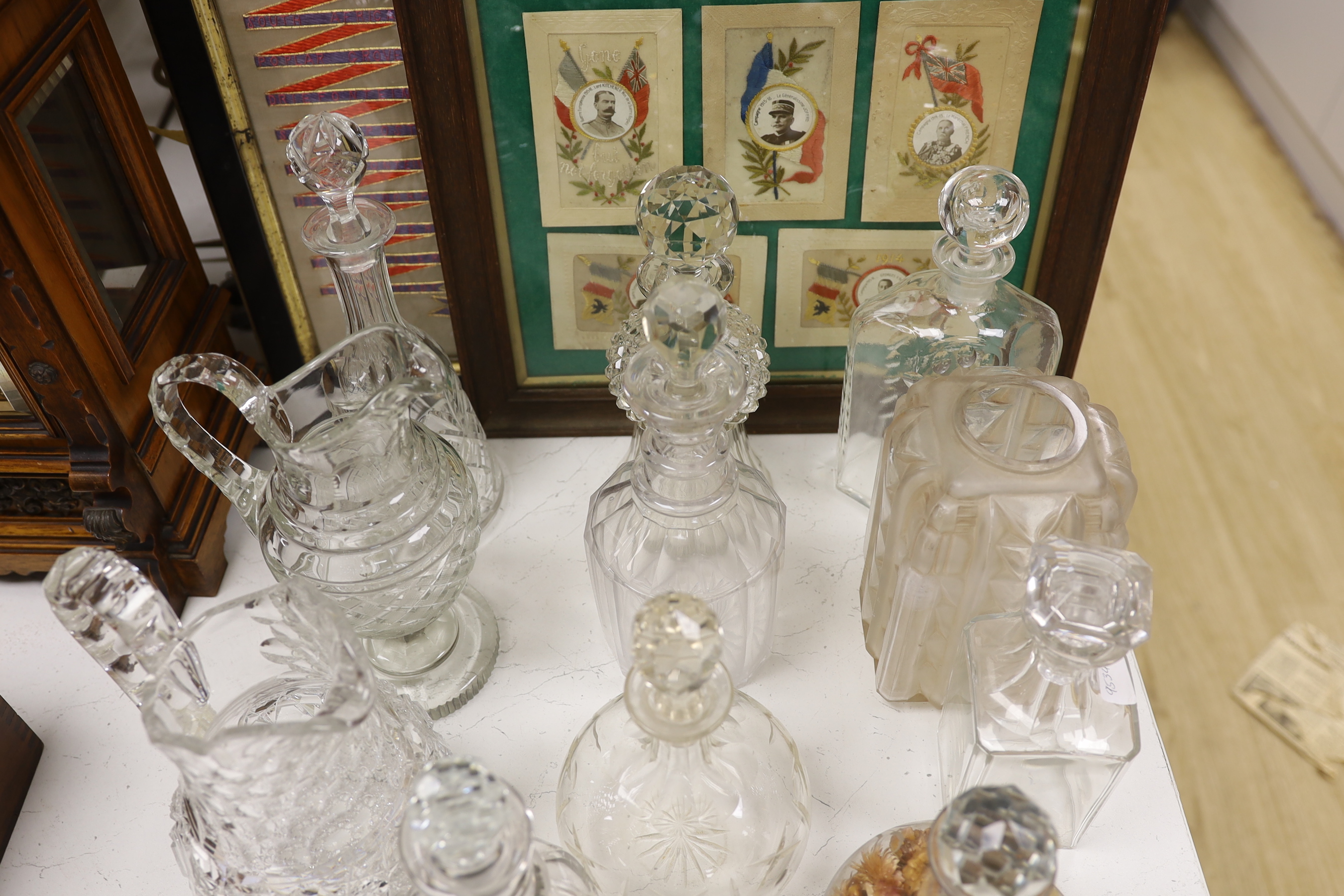 A quantity of cut glass decanters and jugs